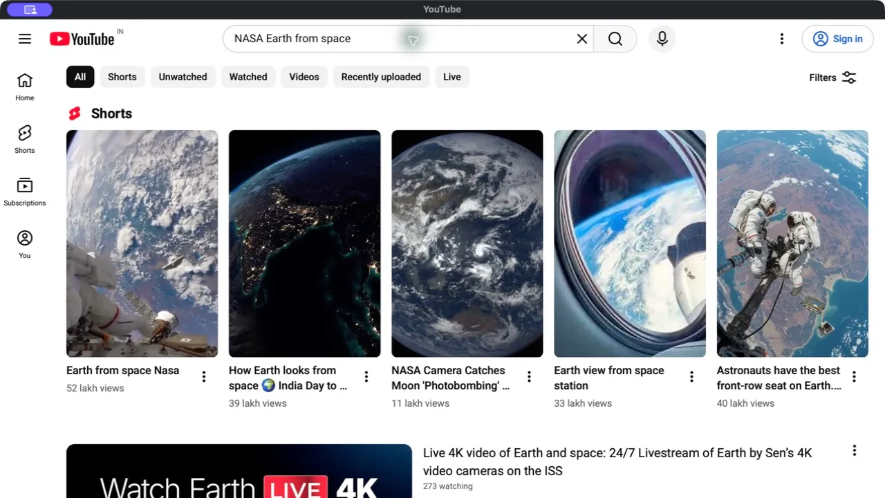 YT Desktop on macOS showing public Earth-from-space search results on YouTube while signed out